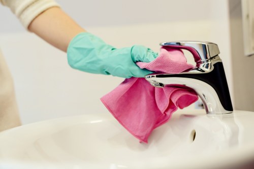Carpet cleaning technician preparing professional equipment before a booked service