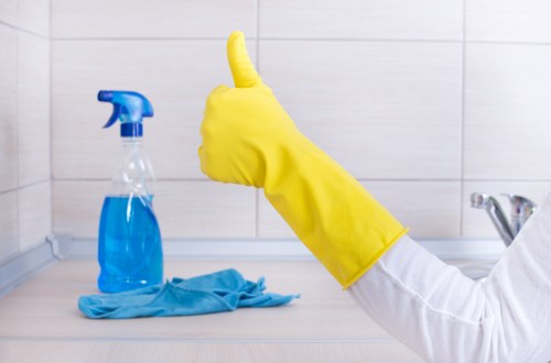 Local technician cleaning a sofa in a Westminster area property